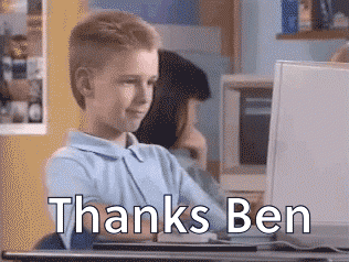 Boy on computer giving thumbs up