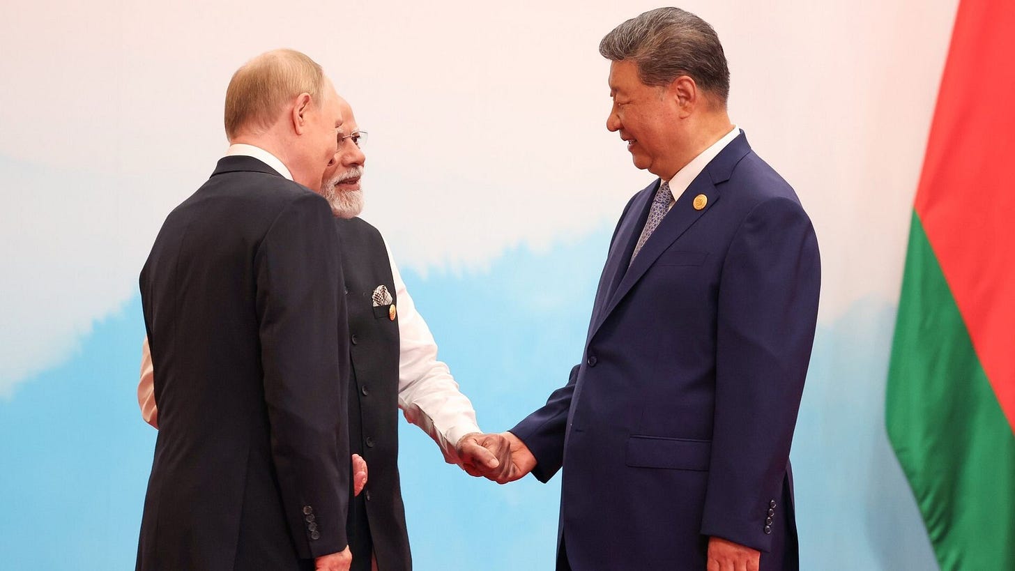 Modi joins hands with Xi and Putin in message to Trump