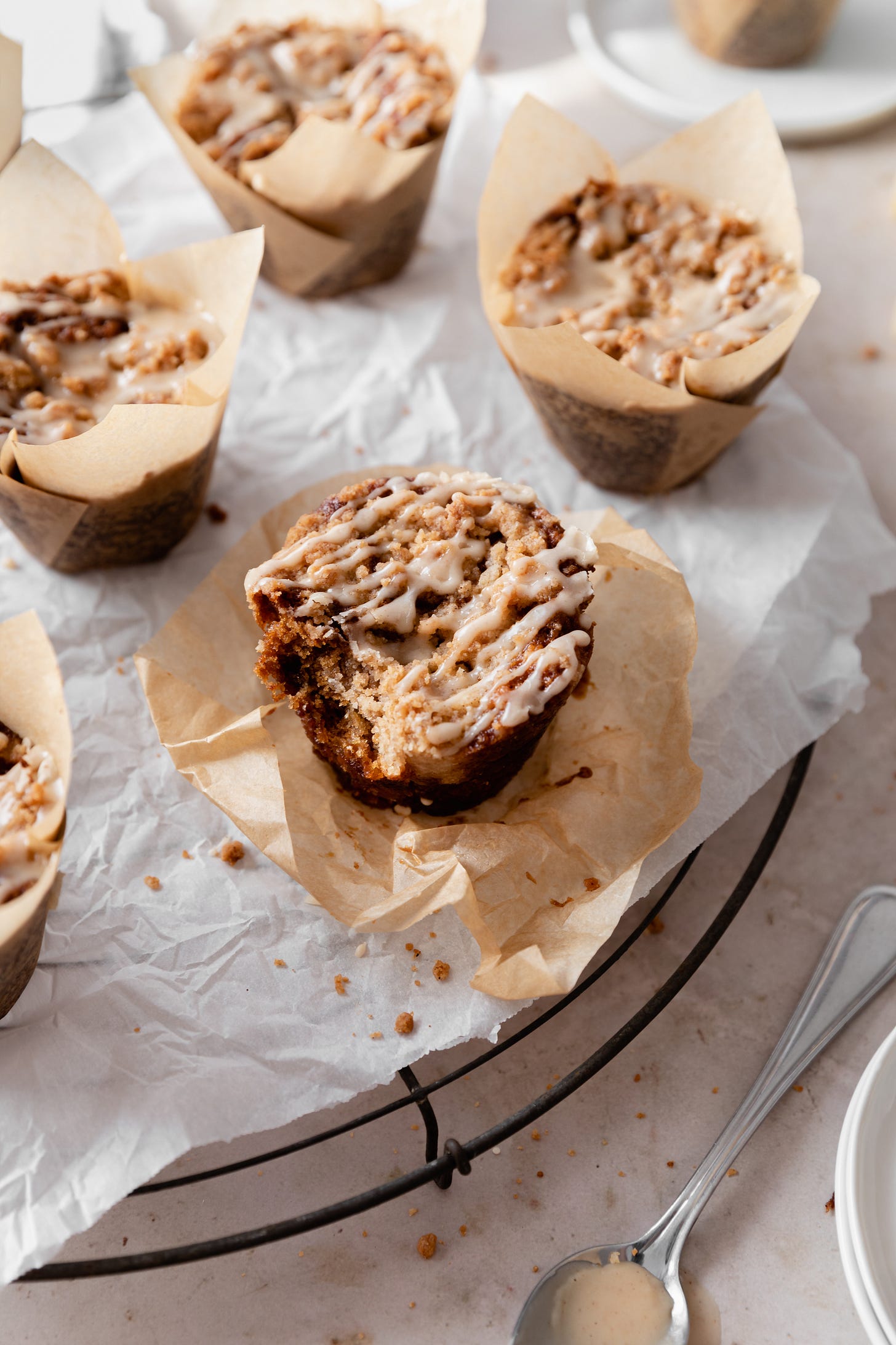 Vegan apple crumble muffins with a bite taken out