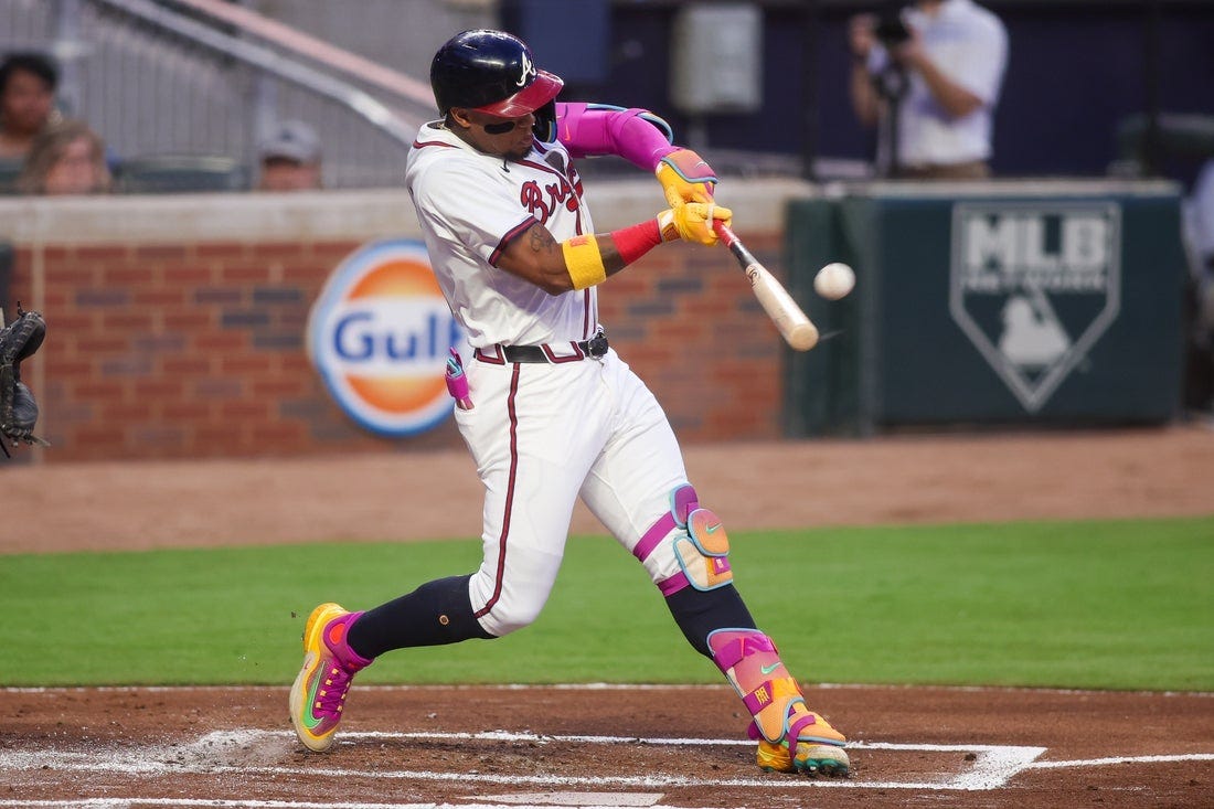 Ozzie Albies hitting a ball