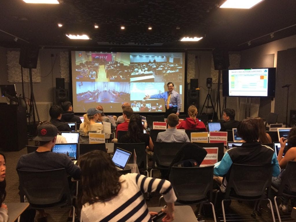 Students interact with global peers from different campuses in iPodia classroom