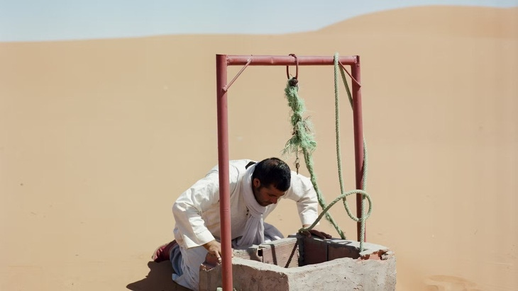 A person at a desert well