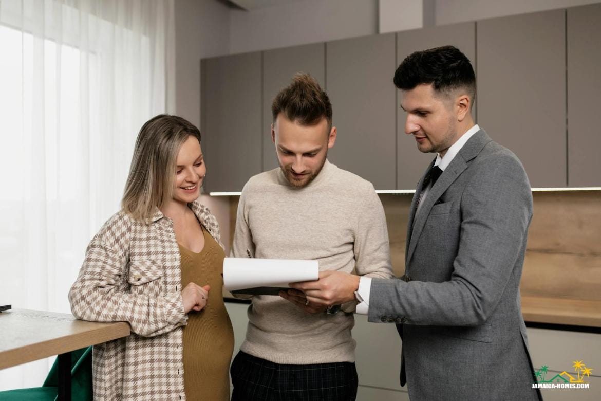 man in beige long sleeve shirt standing beside a pregnant woman