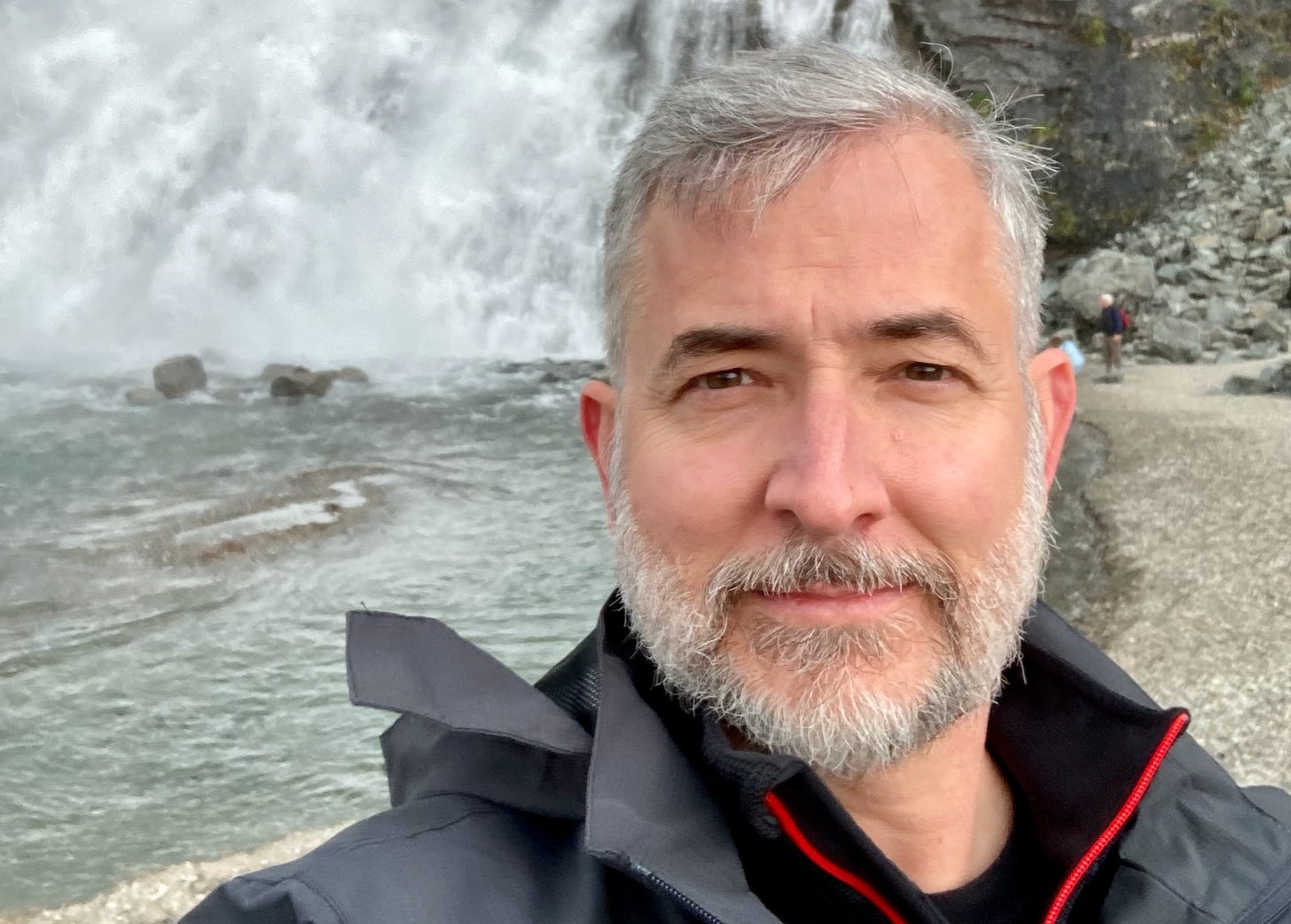 Larry Cornett near waterfall