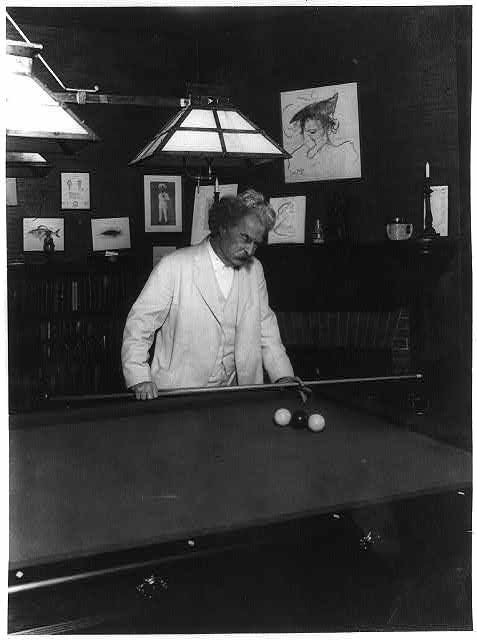 a black and white photograph of a man in a white suit playing pool a black and white photograph of a man in a white suit playing pool