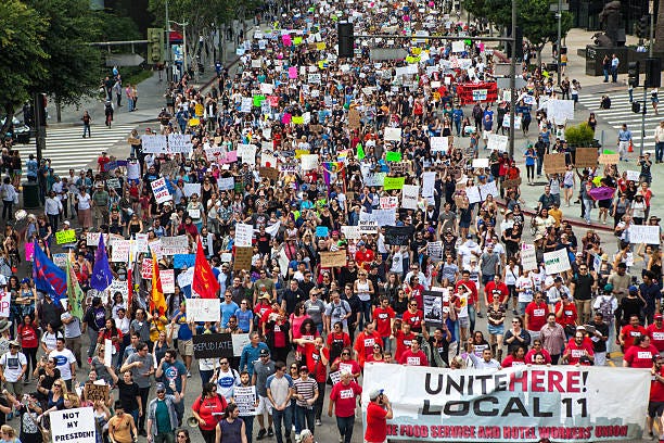 trump protest march, figueroa street downtown los angeles - los angeles protest figueroa street stock pictures, royalty-free photos & images
