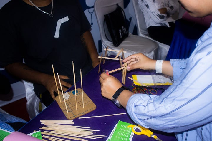 From left: HE Ambassador Dean Thompson exploring the Book Bus and students engaging with the Book Bus materials.