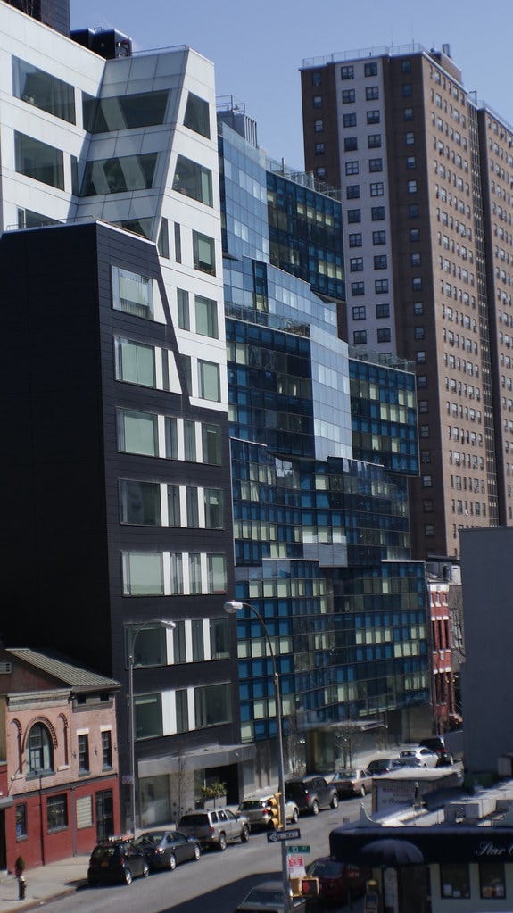 10-story modern apartments: angular buildings with slick glass windows. no human life is visible. 10-story modern apartments: angular buildings with slick glass windows. no human life is visible.