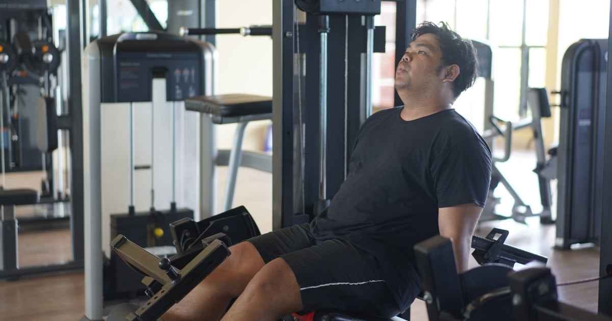 Man using the leg press machine at the gym