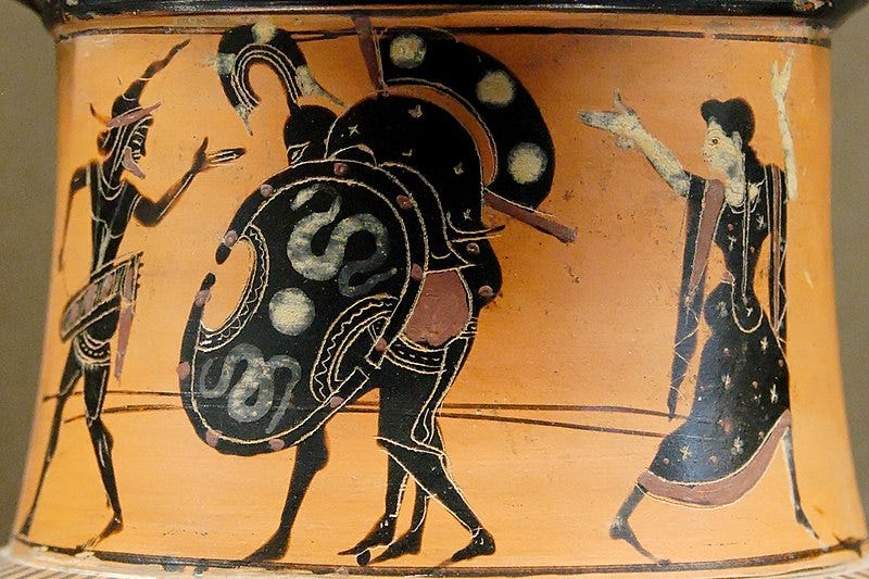 jax carrying the dead Achilleus, protected by Hermes (on the left) and Athena (on the right). Side 1 from an Attic black-figure neck-amphora, ca. 520-510 BC. jax carrying the dead Achilleus, protected by Hermes (on the left) and Athena (on the right). Side 1 from an Attic black-figure neck-amphora, ca. 520-510 BC.