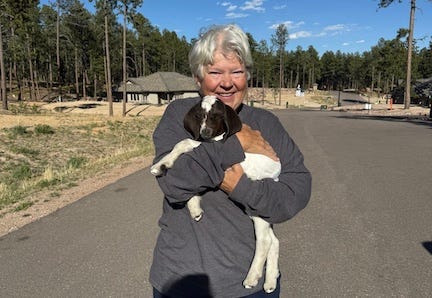 Dr Jean holding a baby goat