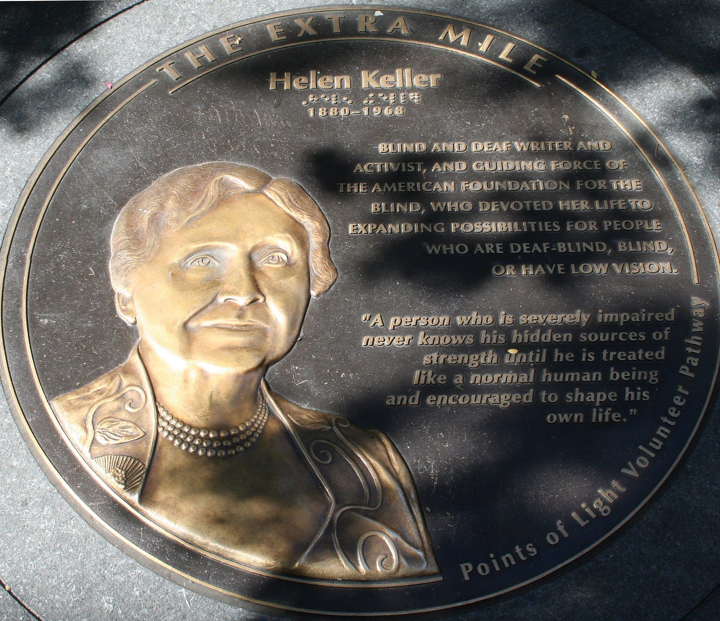 Plaque of Helen Keller titled The Extra Mile