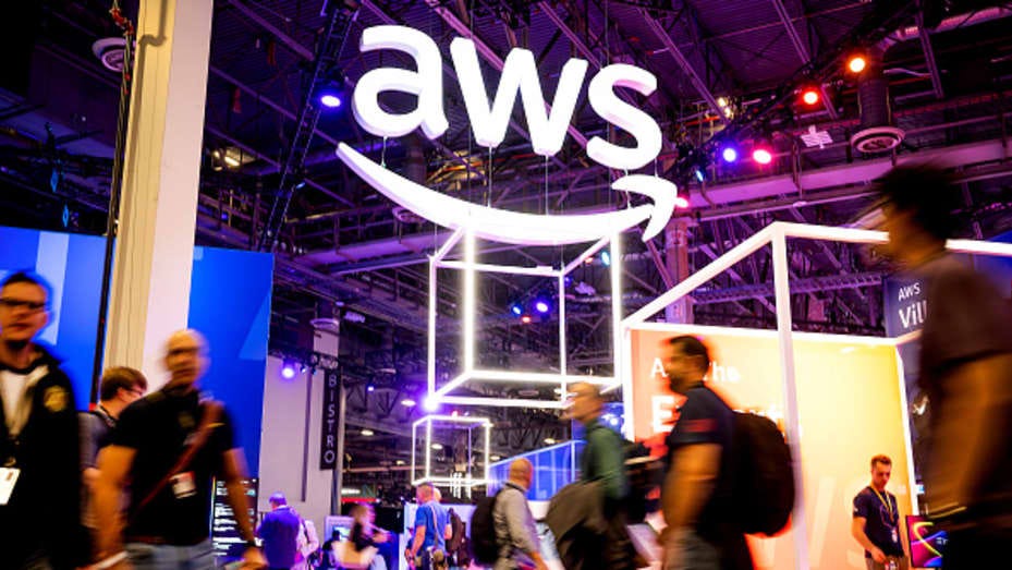 Attendees walk through an expo hall during Amazon Web Services' Reinvent conference at the Venetian in Las Vegas on Nov. 29, 2022.