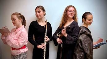 A group of women holding instruments

AI-generated content may be incorrect.