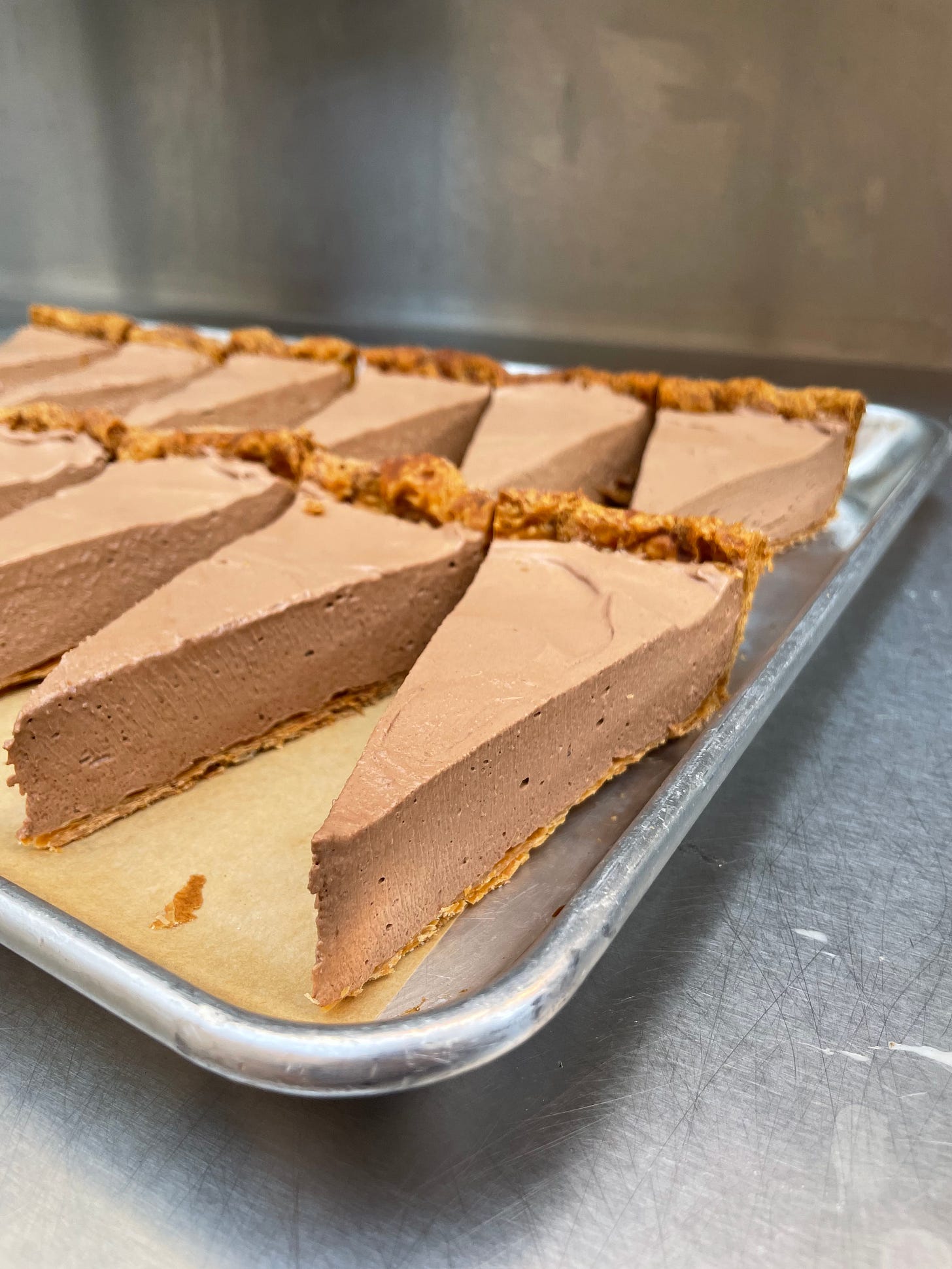 a tray of individually sliced pieces of pie
