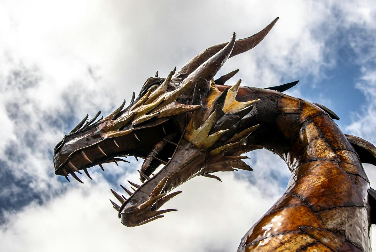 A dragon statue from a low angle.