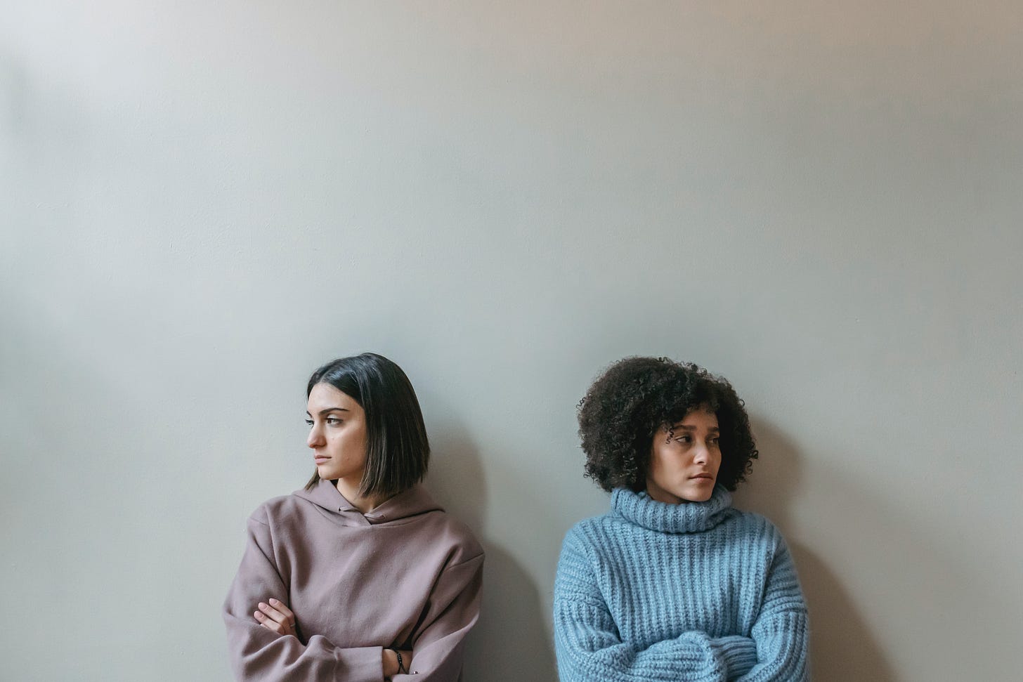 women distressed not looking at each other not talking