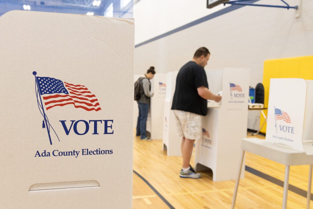 Voters cast their ballots at Fairmont Junior High in Boise during the Idaho primary election