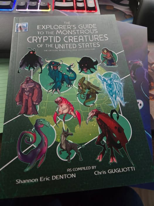 May be an illustration of text that says 'THE EXPLORER'S GUIDE TO THE MONSTROUS CRYPTID CREATURES OF H UNITED STATES THE CR Ficim MONSIERFORG WW.OFERCELMC.ETEONECO MONSIE CHYP1ORKONIE 기근 新世 小 AS COMPILED BY Chris GUGLIOTTI Shannon Eric DENTON'