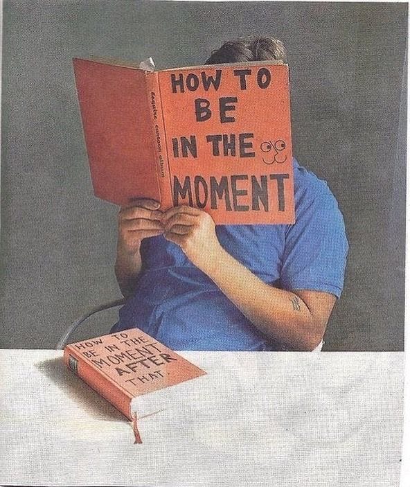 This may contain: a man sitting at a table reading a book with the words how to be in the moment