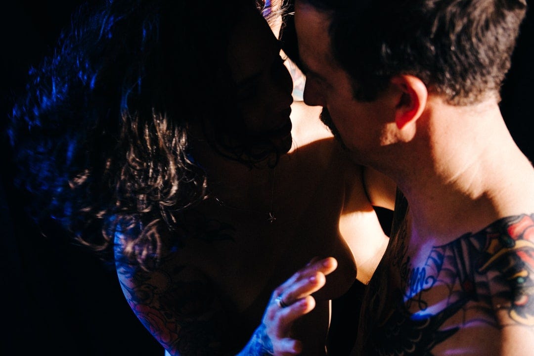 a man kissing a woman on the cheek a man kissing a woman on the cheek
