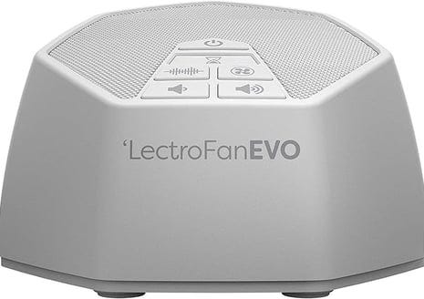 a speaker with a remote control and a remote control