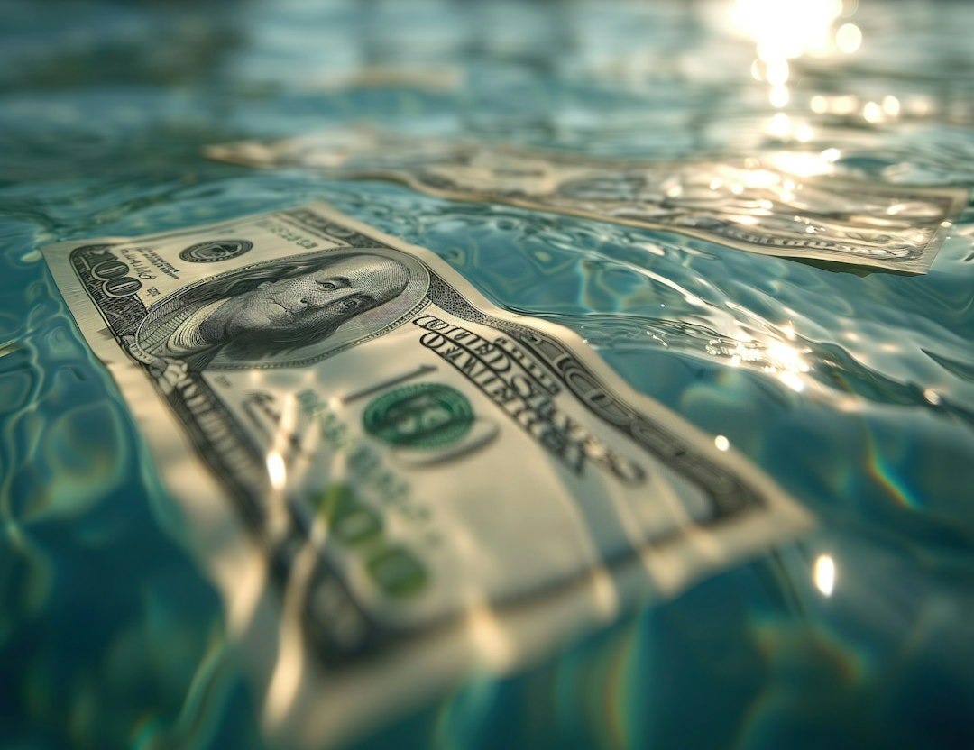 a dollar bill floating in a pool of water a dollar bill floating in a pool of water