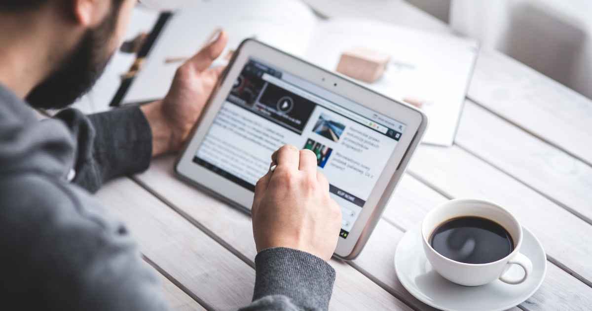 Man browsing the internet on a tablet