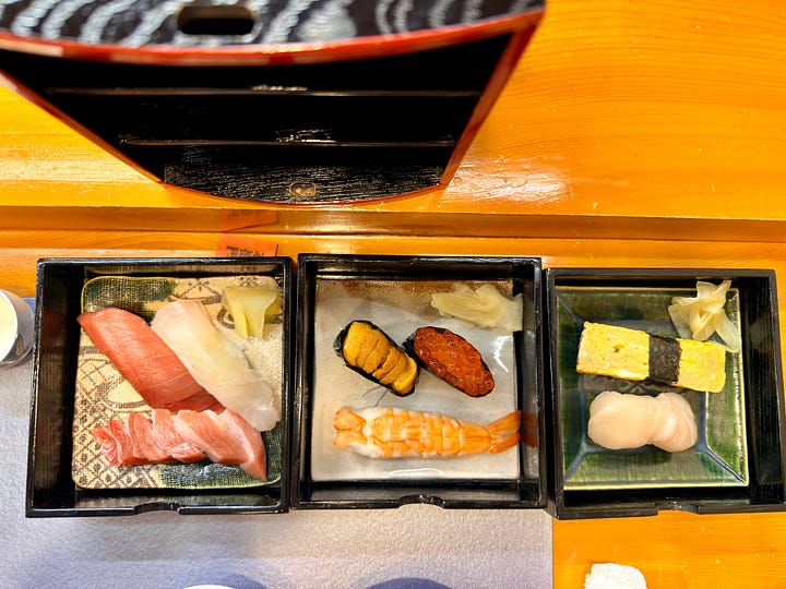 Three box set which included a sperm sac appetizer, a three tiered sushi bento and an extra grilled scallop