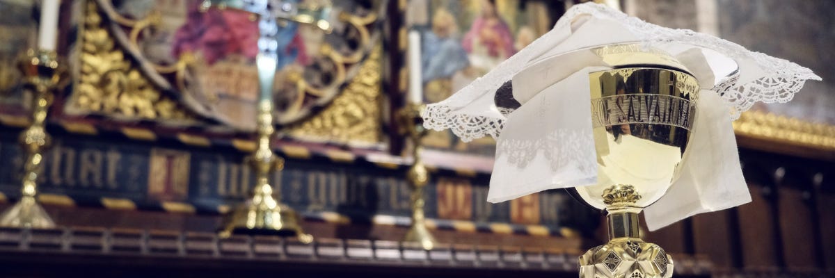 Photo of a communion chalice on an altar Photo of a communion chalice on an altar