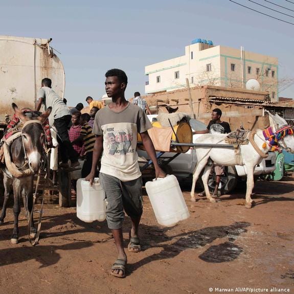 People gather to collect water in Khartoum, Sudan, Sunday, May 28, 2023. People gather to collect water in Khartoum, Sudan, Sunday, May 28, 2023.