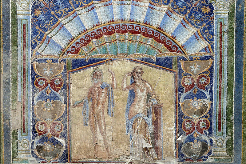 Large formal mosaic showing an exceptionally beautiful man and woman—by Roman standards—naked but for elegantly draped shawls, surrounded by large stylized flowers and winecups and symmetric designs like waves of the sea in rich colors of gold and blue and burgundy. Large formal mosaic showing an exceptionally beautiful man and woman—by Roman standards—naked but for elegantly draped shawls, surrounded by large stylized flowers and winecups and symmetric designs like waves of the sea in rich colors of gold and blue and burgundy.