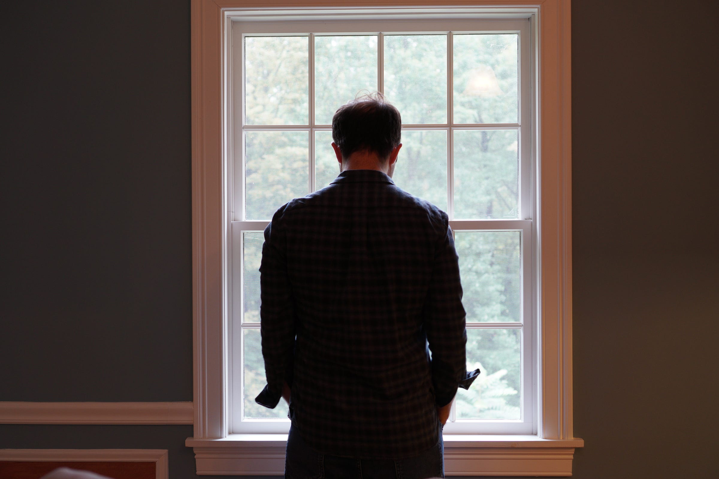 Man looking down in grief