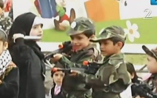 A young Palestinian girl attacks 'Israeli soldiers' with a knife in a play held in Gaza as part of the 'Palestine Festival for Children and Education,' April 2016 (Channel 2 news)