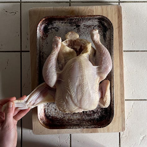 Tucking the chicken wing under for roasting