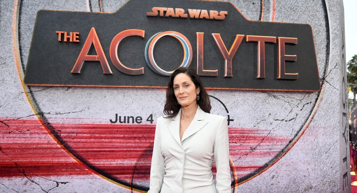 Carrie-Anne Moss Says Prioritizing Motherhood Over Her Career "Was The Greatest Decision I Ever Made In My Life"