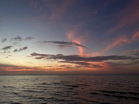 photos of sunsets and beach scenes after dark in Holbox, Mexico. The nighttime beach scenes appear to have been taken during the daytime, but because of the phone camera's ability to regulate light, the photos look like they were taken during the day. 