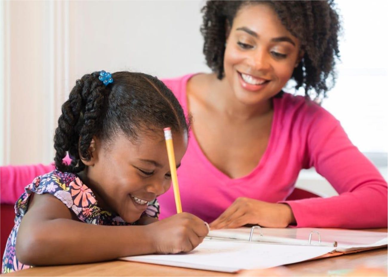 parent helping child with writing