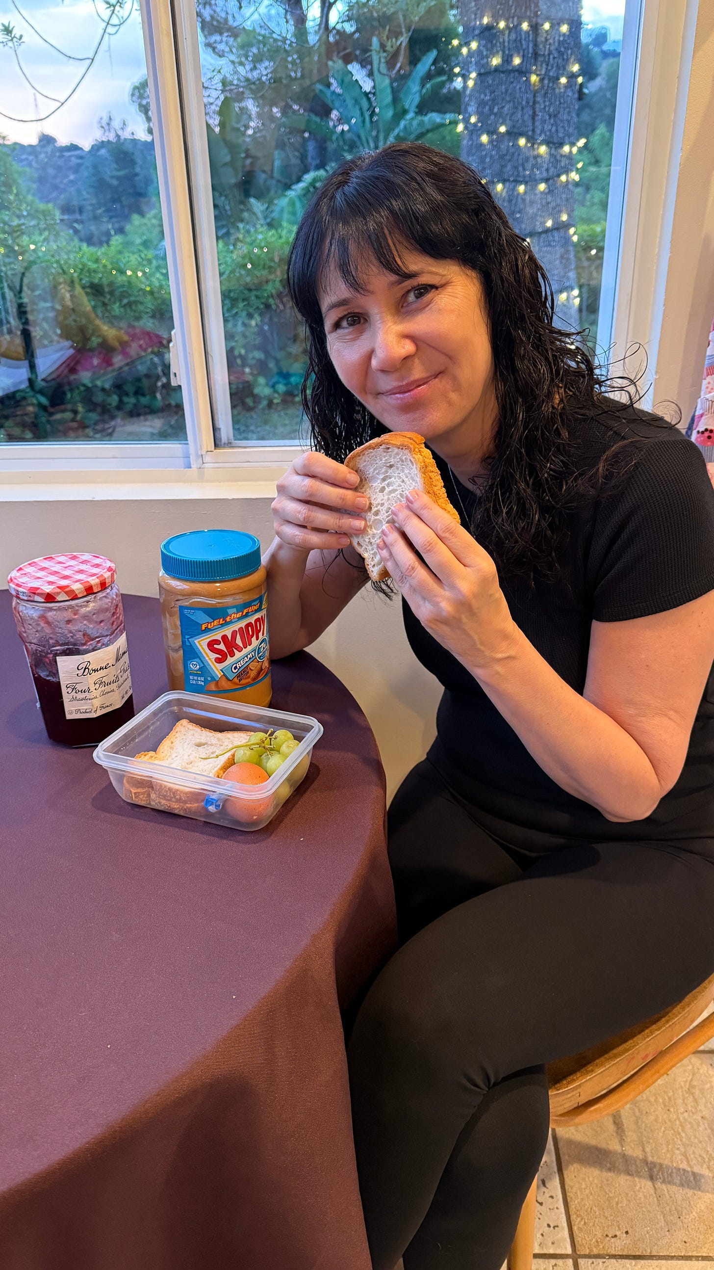 Laverne eating a peanut butter and jelly sandwich.