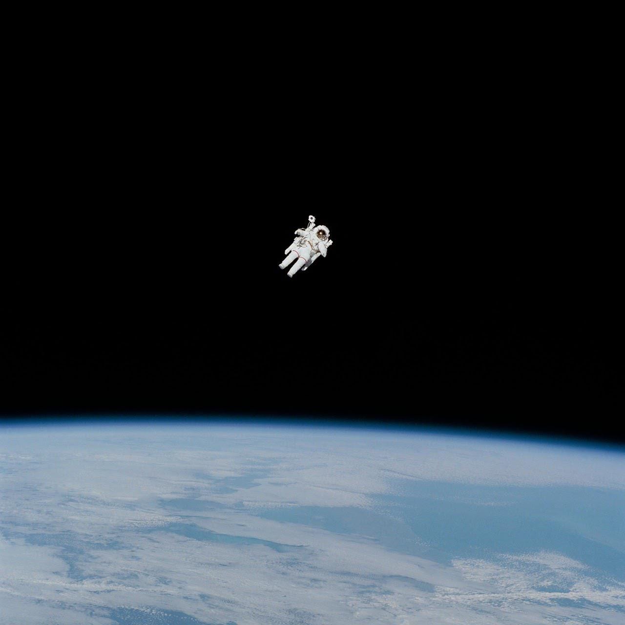Astronaut Bruce McCandless performs the first untethered spacewalk using a nitrogen-propelled Manned Maneuvering Unit (MMU), 300 feet from the shuttle, on February 7, 1984.