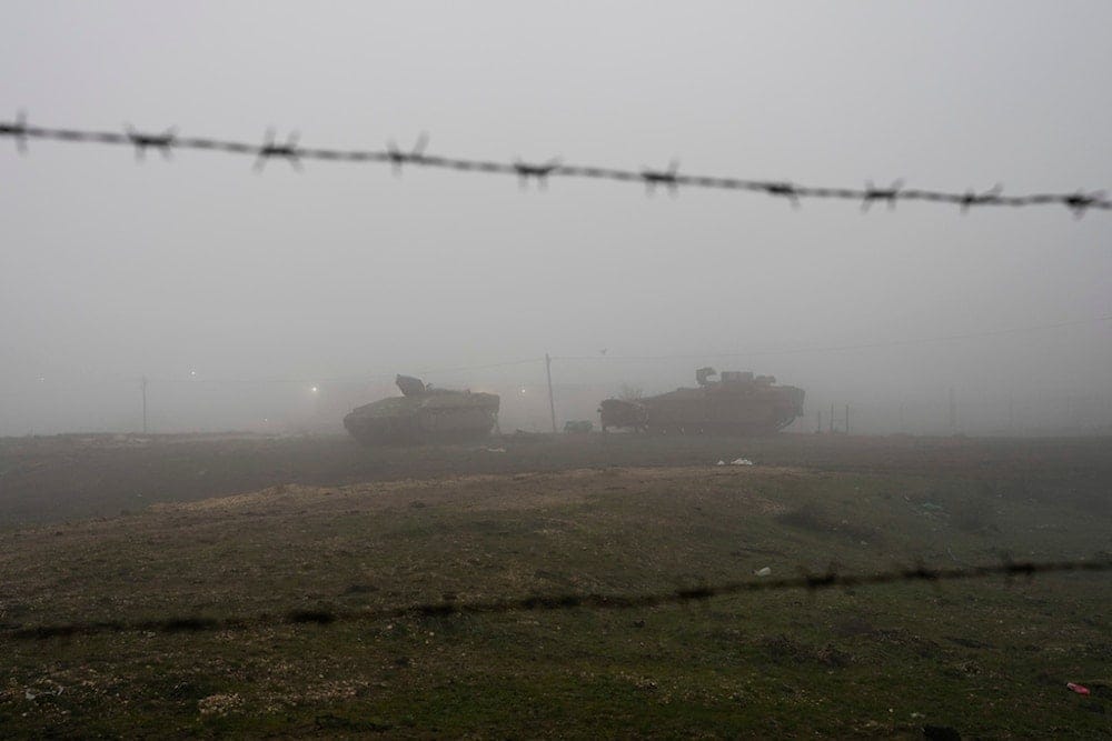 Israeli armored vehicles park on the side of a road in the Israeli-controlled Golan Heights, on Sunday, December 22, 2024 (AP) Israeli armored vehicles park on the side of a road in the Israeli-controlled Golan Heights, on Sunday, December 22, 2024 (AP)