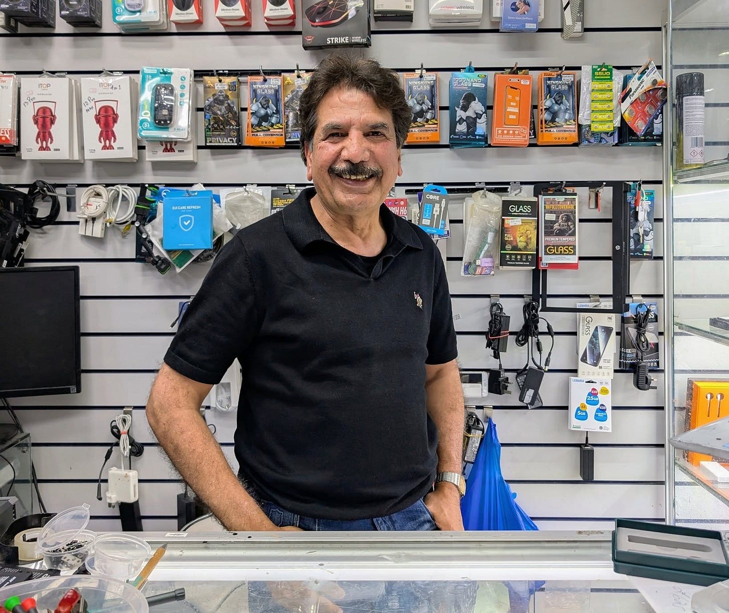 May be an image of 1 person, phone and text