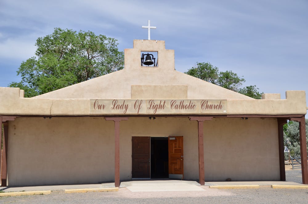 Entrance to the parish in Cubero. The concrete entrance and improved ramp are examples of improved accessibility.