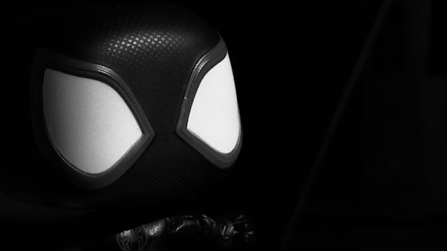 A bobble head spider-man in black and white A bobble head spider-man in black and white