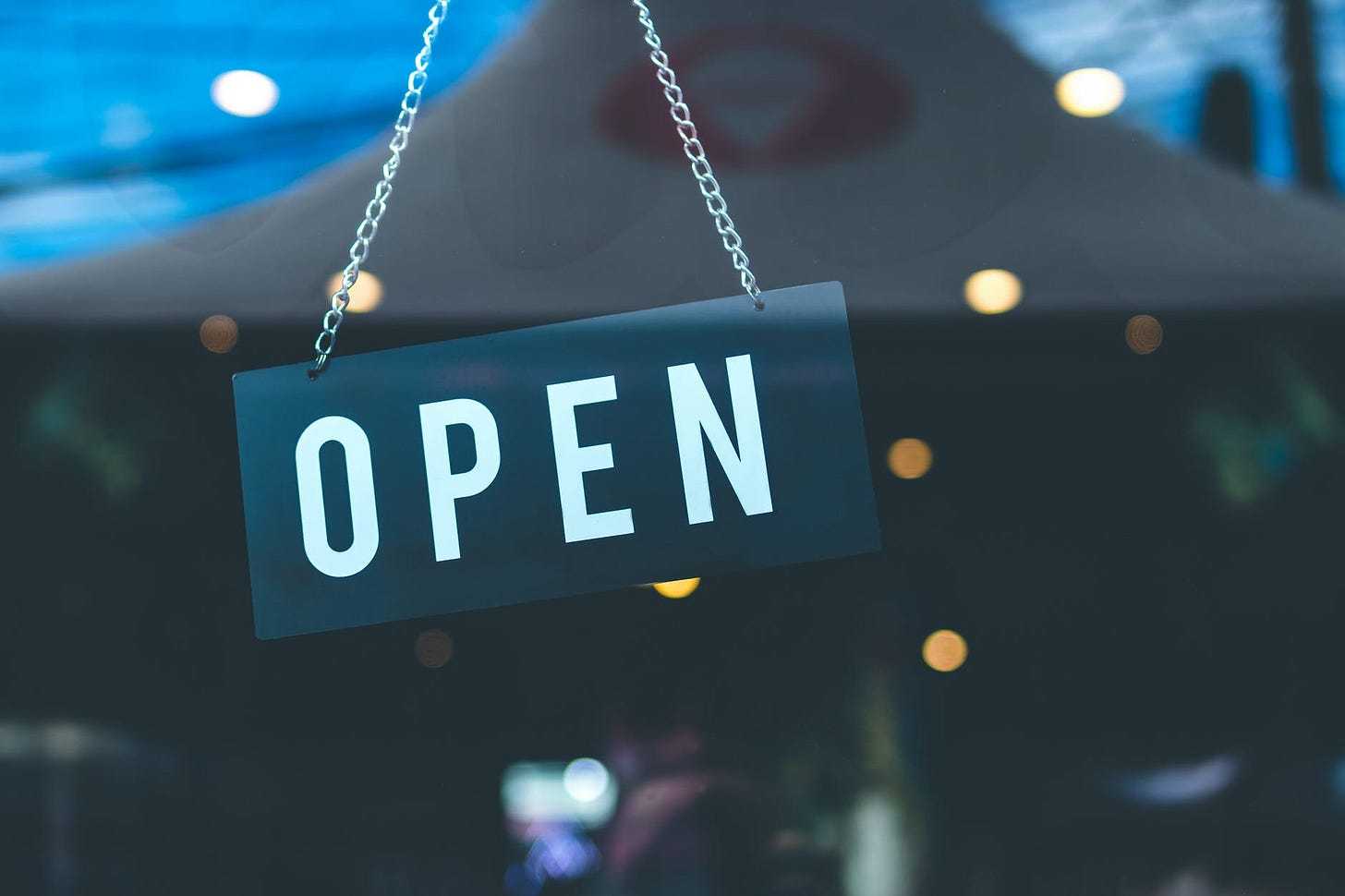 selective focus photography of open signage selective focus photography of open signage