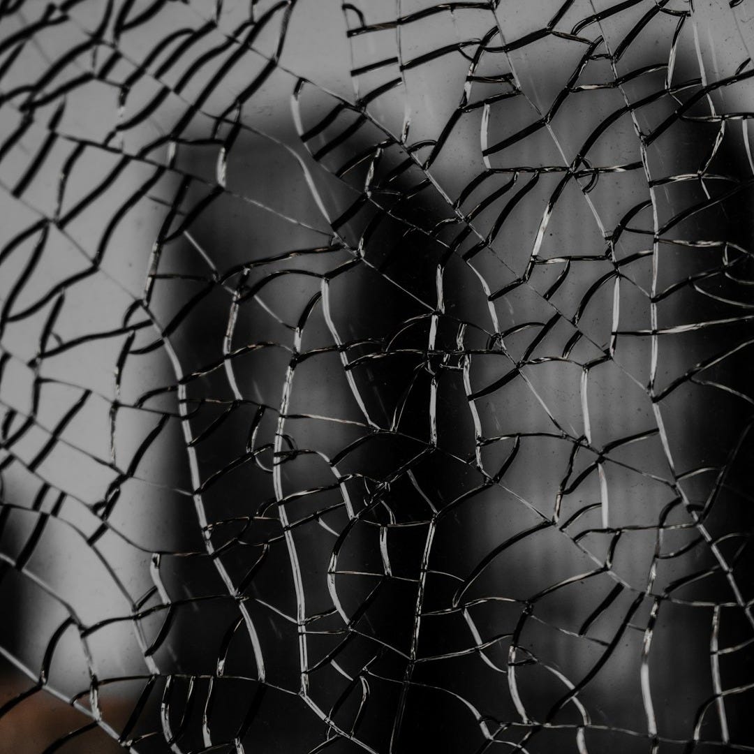 a close up of a broken glass window