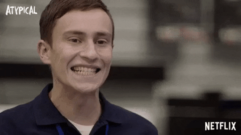 Gif of atypical autistic boy grinning awkwardly