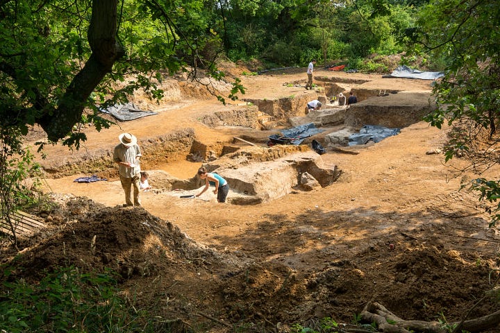 Excavation of 400,000-year-old pond sediments at Barnham, England; an ancient campfire site, with reddened sediment indicating heated clay.Credit...Jordan Mansfield/Pathways to Ancient Britain Project
