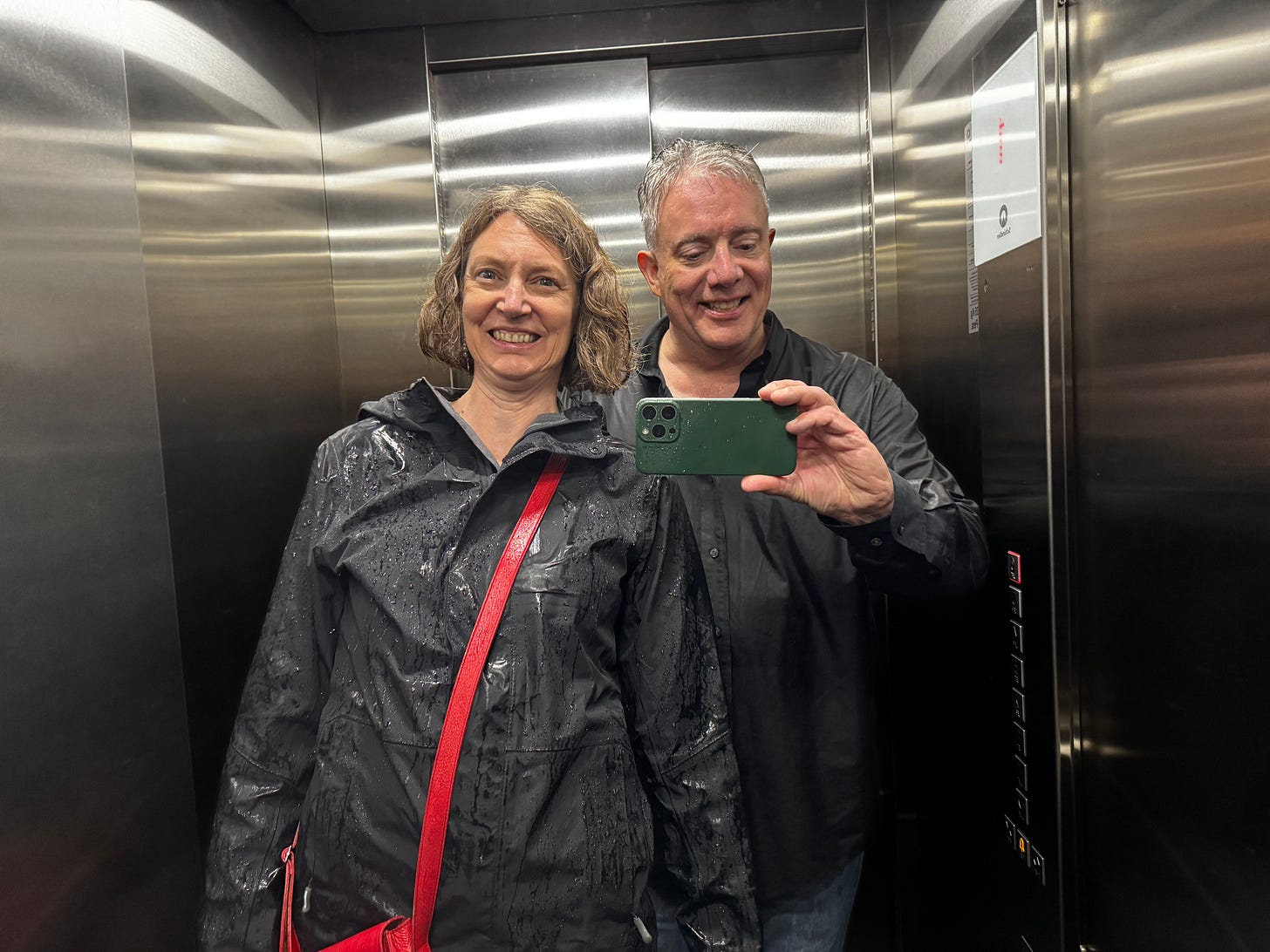 Two people in an elevator, rainy season, Mexico City Two people in an elevator, rainy season, Mexico City