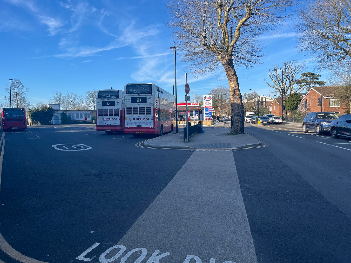 Photo of two SL4 buses waiting at Grove Park bus depot.